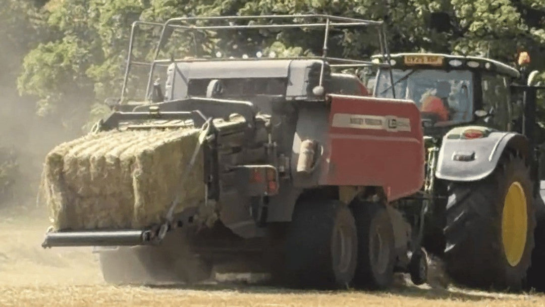 Tractor baling new hay for horses